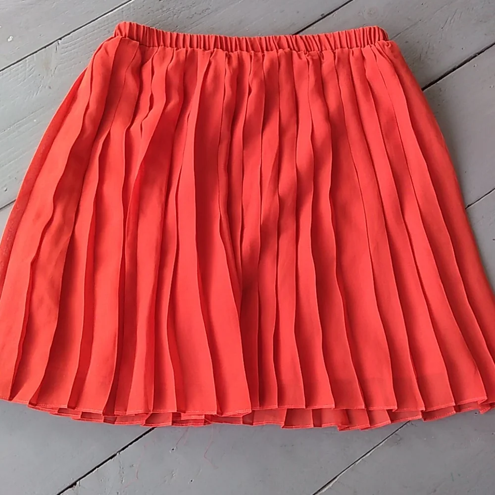 Sparkle and fade knife pleat orange skirt